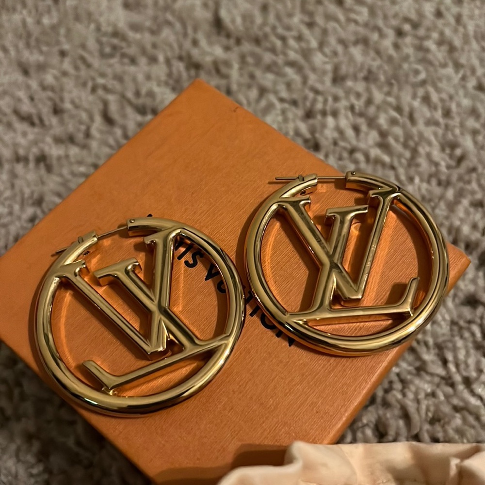 Louis Vuitton gold hoop earrings.